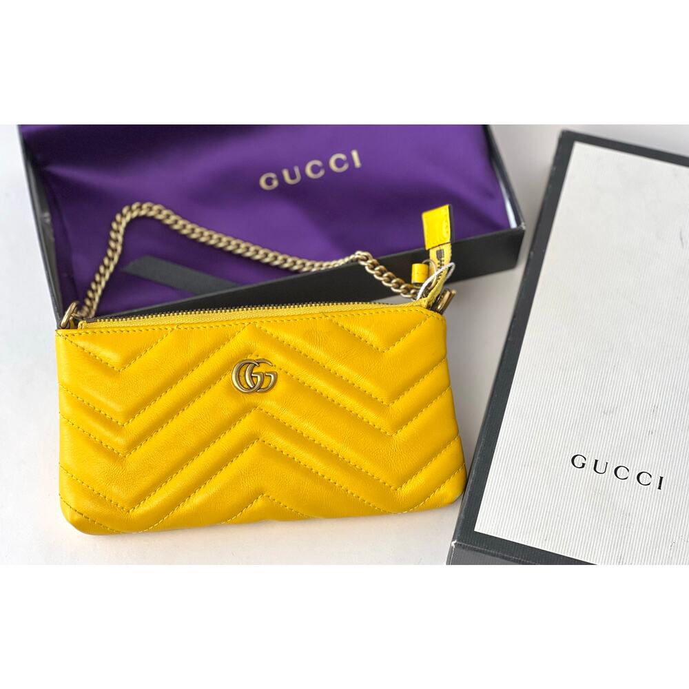 Gucci GG Marmont matelassé chevron leather wristlet wallet Pouch in Yellow.